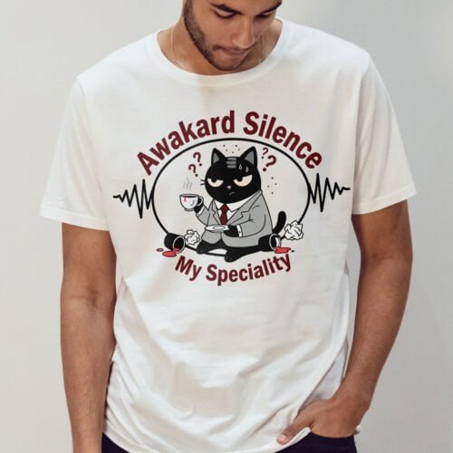 awkward-silence-tshirt-white-male-model Black Scowl cat graphic t-shirt on a male model, featuring the slogan "Awkward Silence My Speciality."