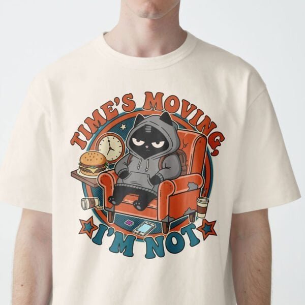 black-scowl-times-moving-beige-shirt-zoom Zoom view of Black Scowl cat on a beige t-shirt, saying 'Time's Moving. I'm Not.'