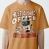 blackscowl-unisex-tee-hustle-cry-cat-ochre-male-front Front view of "Hustle Hard, Office Cry Harder" tee in Ocre/Mustard