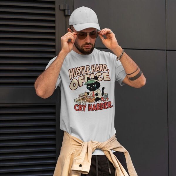 blackscowl-unisex-tee-hustle-cry-cat-white-male-style Male model wearing "Hustle Hard, Cry Harder" tee - Corporate Humor