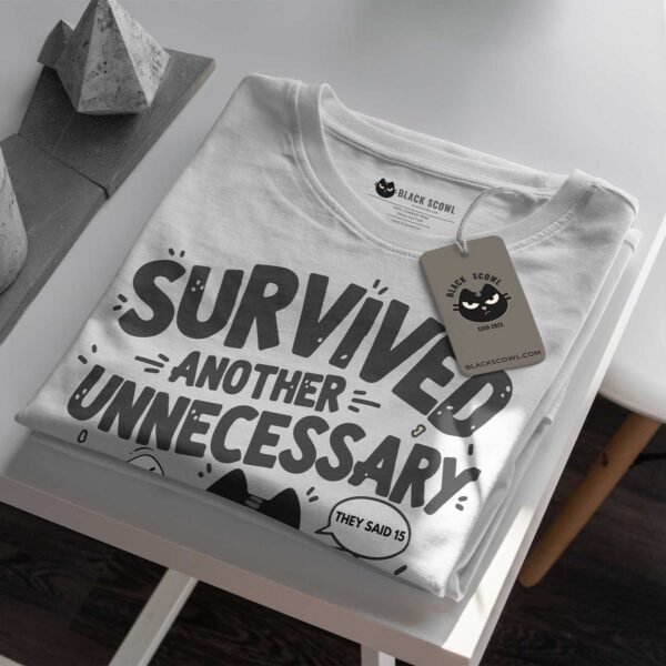 blackscowl-unisex-tee-meeting-cat-folded-tag-detail Detail of Black Scowl custom tag on "Unnecessary Meeting" tee