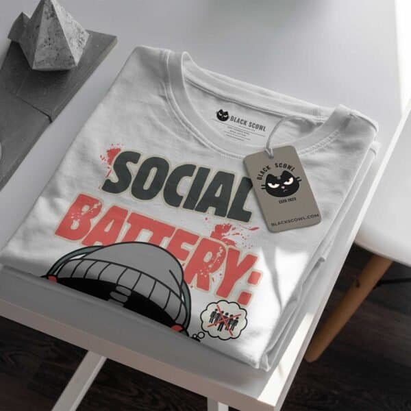 blackscowl-unisex-tee-social-battery-low-folded-tag-detail Folded Black Scowl tee with "Social Battery Critically Low" design and custom tag