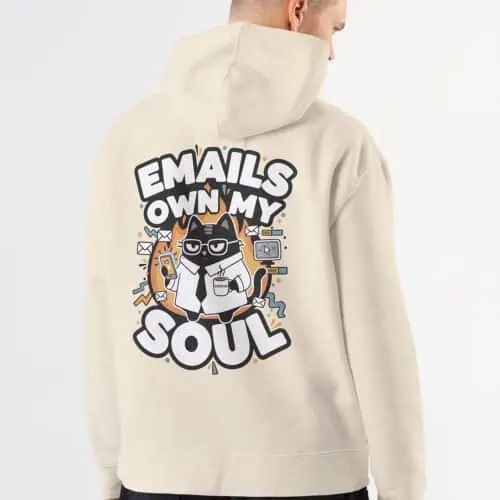 existential-dread-man-bone-hoodie-cat-design Man working remotely (WFH) on a laptop, wearing the military green sarcastic "Emails Own My Soul" hoodie.