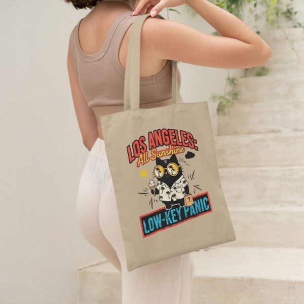 existential-dread-oyster-tote-bag-urban Young woman carrying the sarcastic "Low-Key Panic" tote bag, reflecting LA or California anxiety humor.