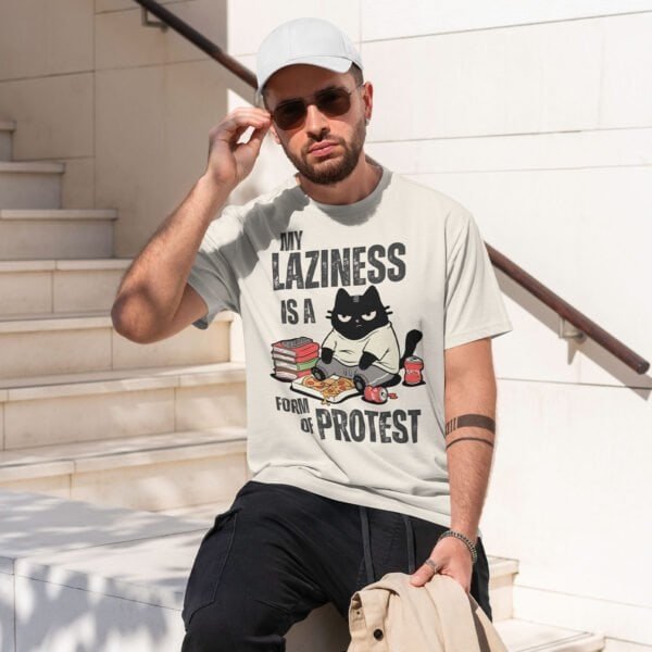 man-sitting-laziness-is-protest-white-shirt My Laziness Is a Form of Protest T-Shirt | Black Scowl Anti-Hustle Tee