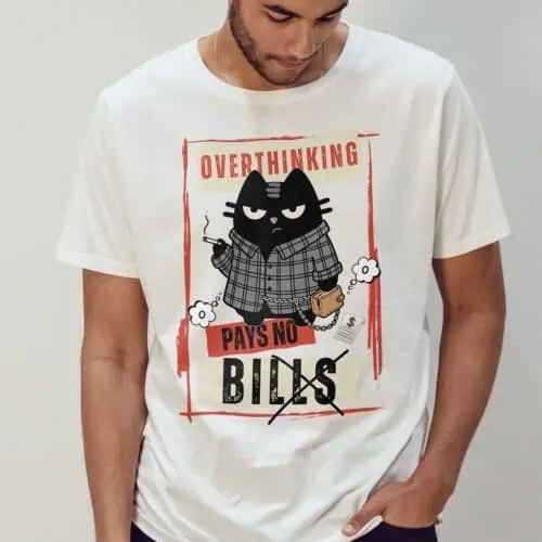 overthinking-cat-tshirt-man-white-simple-mockup Man modeling white "Overthinking Pays No Bills" cat t-shirt. Cynical humor apparel.