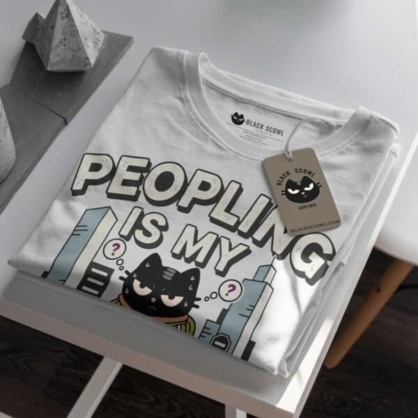 peopling-is-my-cardio-black-scowl-folded-tshirt-tag Folded white t-shirt showing the 'Peopling is my Cardio' graphic and Black Scowl brand tag.
