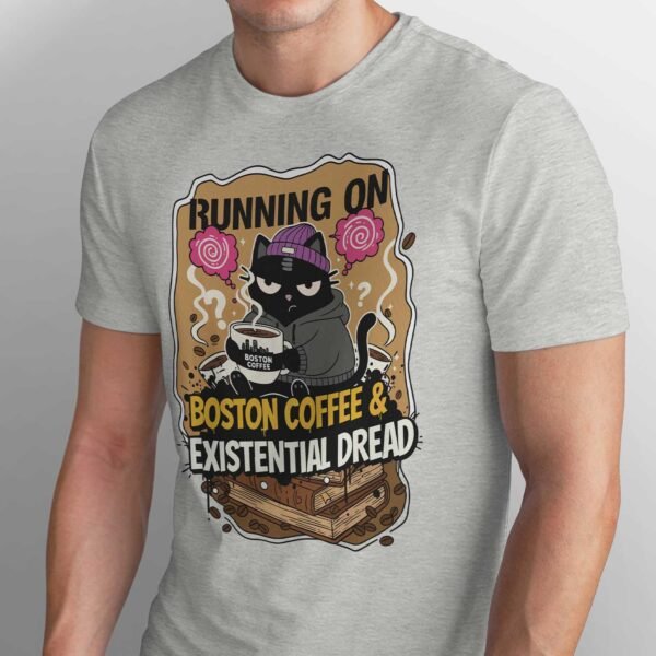 Close-up of the Black Scowl design showing a grumpy cat holding a large mug of Boston Coffee sitting on books.