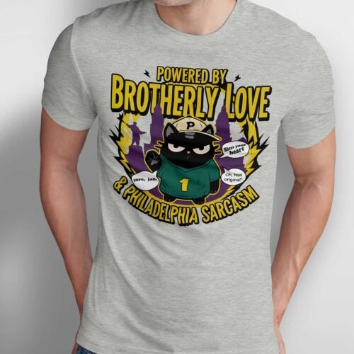 Black Scowl cat wearing a green Philly jersey and cap with "Powered by Brotherly Love & Philadelphia Sarcasm" graphic on a model.