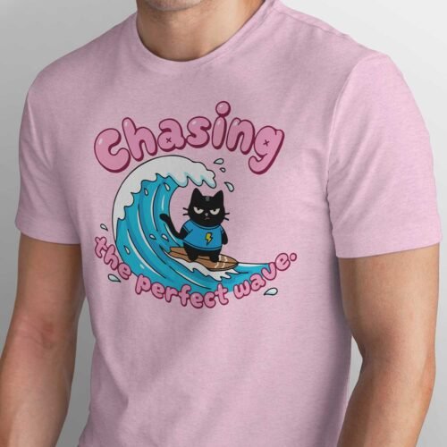 Black Scowl grumpy black cat surfing t-shirt on vintage white Bella Canvas 3001, ironic summer vibe graphic tee with pink text chasing the perfect wave.