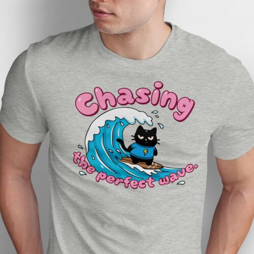 Close up of grumpy black cat wearing blue shirt with lightning bolt surfing on a wave, high quality DTG print detail for urban sarcasm clothing.