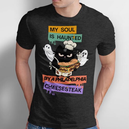Black Scowl graphic tee featuring a chef cat holding a giant cheesesteak with the text My Soul is Haunted by a Philadelphia Cheesesteak.