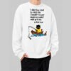 Front view of a model wearing the white Black Scowl sweatshirt. This edgy streetwear crewneck features a funny, antisocial graphic of a sarcastic cat in a boat avoiding people.
