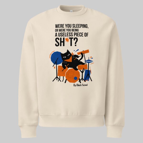 Flat front view of the Black Scowl cream sweatshirt. An edgy, streetwear-inspired garment showcasing a grumpy black cat playing drums with an ironic, modern quote.