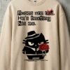 Close-up detail of the Black Scowl cynical cat design and sarcastic text printed on premium heavyweight fleece sweatshirt fabric.