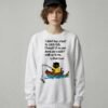 Woman modeling a white oversized streetwear crewneck featuring the dark humor introvert quote and cat design by Black Scowl.