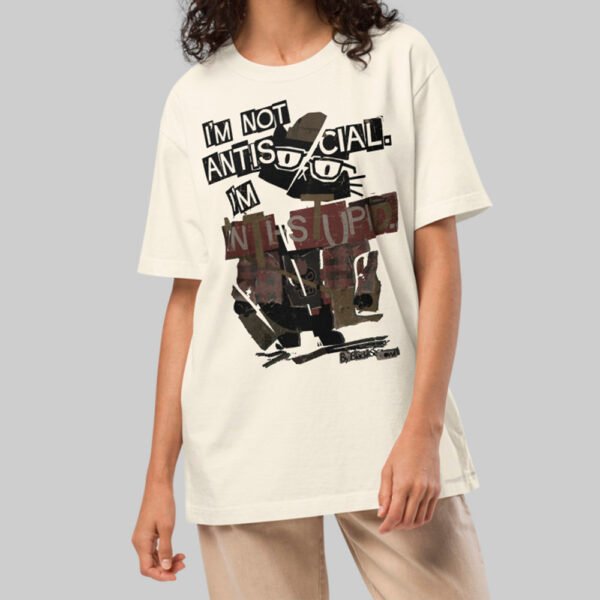 A female model wearing the Black Scowl cream oversized shirt, demonstrating the versatile unisex streetwear fit and minimalist urban style.