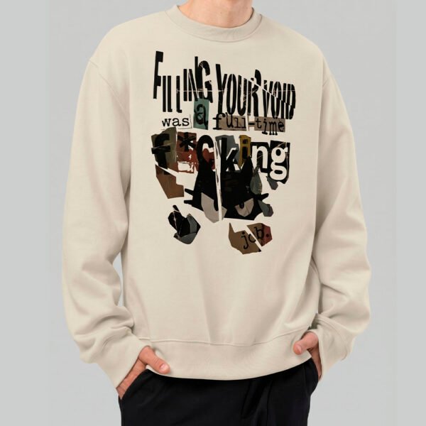 Front view of a model wearing the Black Scowl beige sweatshirt, featuring an edgy urban clothing design with sarcastic typography.
