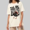 A female model showcasing the Black Scowl cream heavyweight graphic tee featuring an edgy UFO design and a structured, high-end streetwear drape.