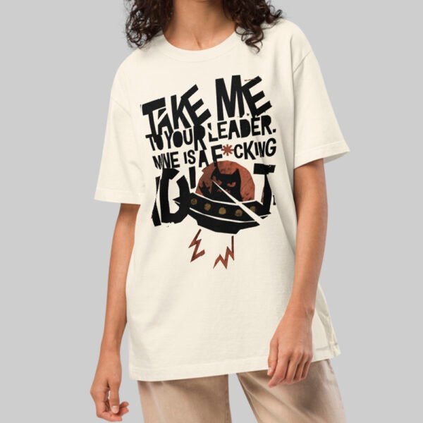 A female model showcasing the Black Scowl cream heavyweight graphic tee featuring an edgy UFO design and a structured, high-end streetwear drape.