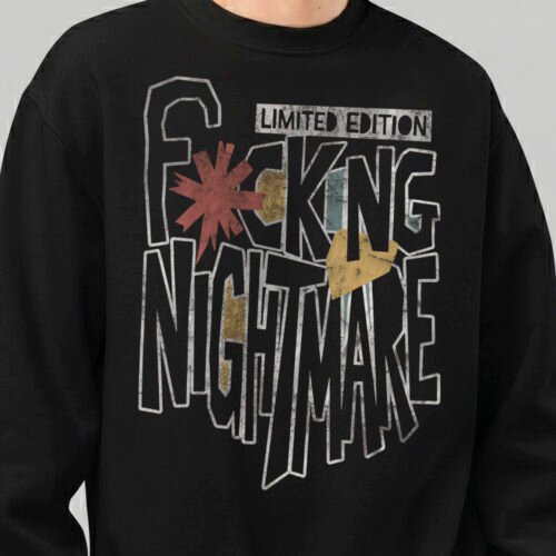 Close-up detail of the "Fcking Nightmare" limited edition graphic on a Black Scowl black sweatshirt, showing the textured font and avant-garde design elements.