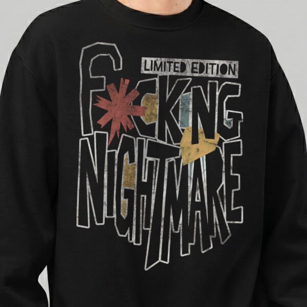 Close-up detail of the "Fcking Nightmare" limited edition graphic on a Black Scowl black sweatshirt, showing the textured font and avant-garde design elements.