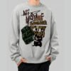 Front view of a model wearing the Black Scowl grey streetwear sweatshirt featuring an edgy dark humor graphic with a sarcastic cat and grunge typography