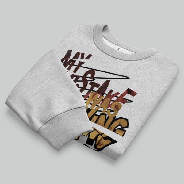 Folded flat lay presentation of the Black Scowl grey streetwear sweatshirt, displaying the bold existential graphic design on modern urban apparel.