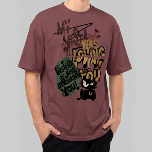 Front view of a male model wearing a Black Scowl maroon heavyweight t-shirt featuring a cynical "My Mistake Was Loving You" graphic with an angry black cat.