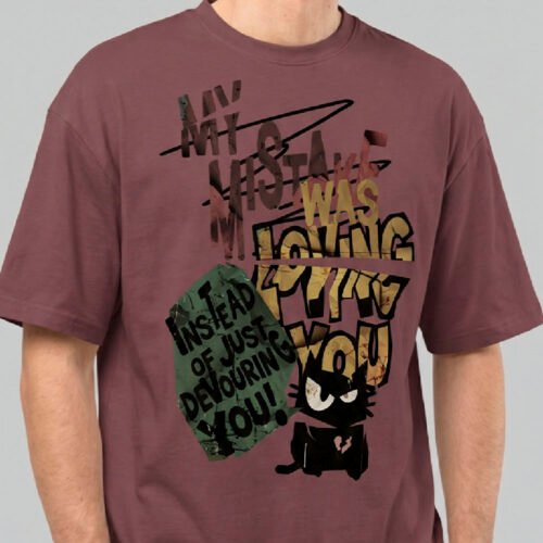 Close-up zoom of the distressed typography and cynical cat illustration on a Black Scowl maroon oversized t-shirt highlighting the high-quality print detail.