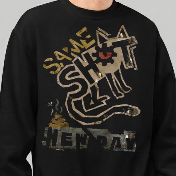 Close-up detail of the Black Scowl black sweatshirt showing the textured vintage print and avant-garde typography of the Same Shit New Day design.