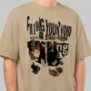 Close-up zoom of the distressed collage print on a Black Scowl sand oversized t-shirt highlighting the premium fabric texture and edgy typography.
