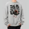 black-scowl-sarcastic-cat-ufo-sweatshirt-grey-lifestyle-front A man wearing a Black Scowl grey streetwear sweatshirt featuring a cynical cat in a UFO with the text Take Me To Your Leader Mine Is A Fool.
