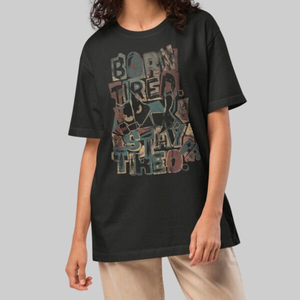 A female model wearing the Black Scowl washed black oversized shirt, demonstrating the versatile unisex streetwear style and high-quality printed design.