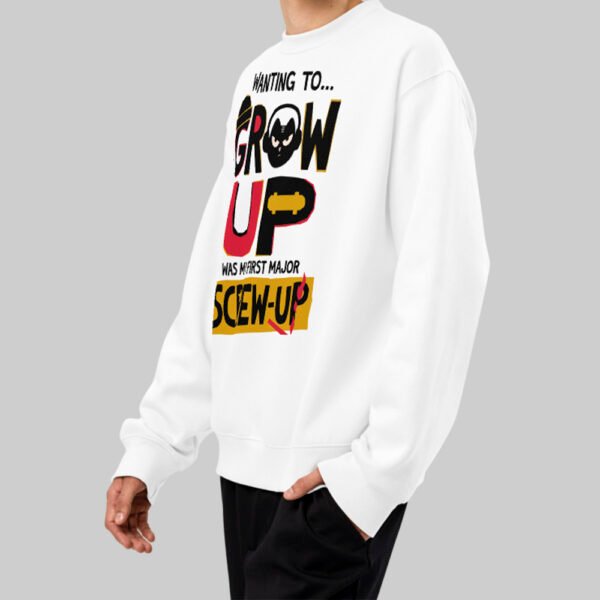 Side profile of a male model wearing the Black Scowl white graphic pullover, demonstrating the modern fit and avant-garde aesthetic of the garment.