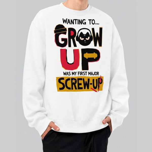 A male model wearing a Black Scowl white sweatshirt featuring a graphic cat design and the sarcastic text Wanting to Grow Up Was My First Major Screw Up in an urban streetwear style.