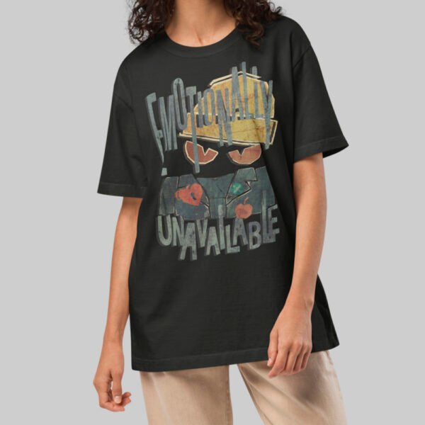 A female model wearing the Black Scowl black heavyweight graphic tee with a modern oversized fit and cynical minimalist style.