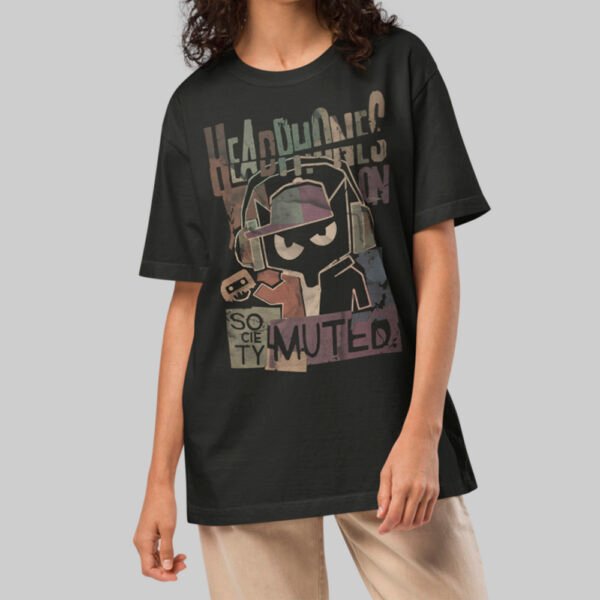 A female model wearing the Black Scowl black heavyweight graphic tee with a modern avant-garde fit and cynical urban design.