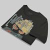 Professional flat-lay shot of a folded Black Scowl black oversized graphic t-shirt showing the interior neck label and high-quality 220g cotton texture.