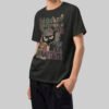 Side angle view of a model in a Black Scowl black streetwear t-shirt showcasing the structured heavyweight fabric and relaxed oversized silhouette.