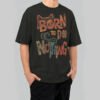 Full view of a model wearing Black Scowl's 220g oversized black t-shirt with a sarcastic cat design and 'Zero Energy Full Attitude' vintage typography.