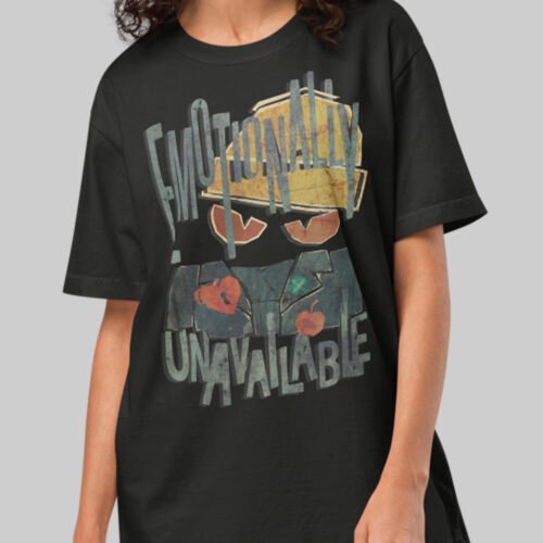 Close-up of a women's heavy cotton oversized t-shirt from Black Scowl featuring a cynical cat with 'Emotionally Unavailable' text in a grunge collage style.